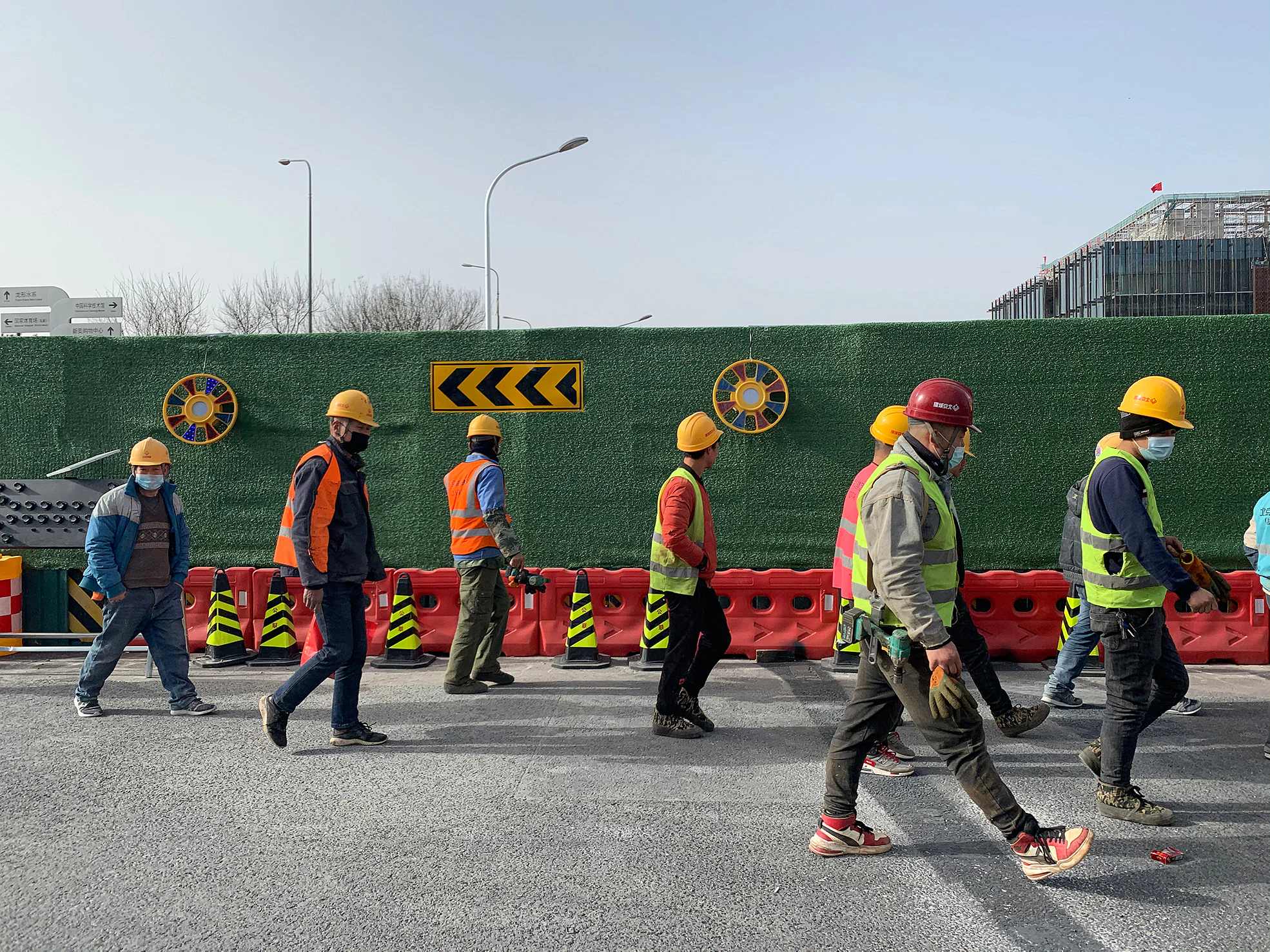 Construction workers in Beijing walking to a worksite in the city. The Majuqiao offers numerous manual, short-term jobs, including those in construction. Photo: Danson Cheong.